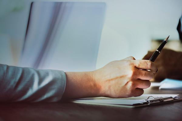 Two people discussing documents