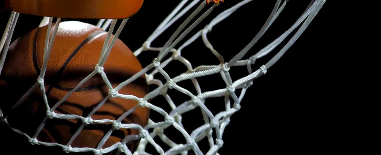 Basketball going into hoop